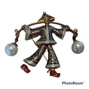 Goldtone brooch Asian man carrying faux pearls